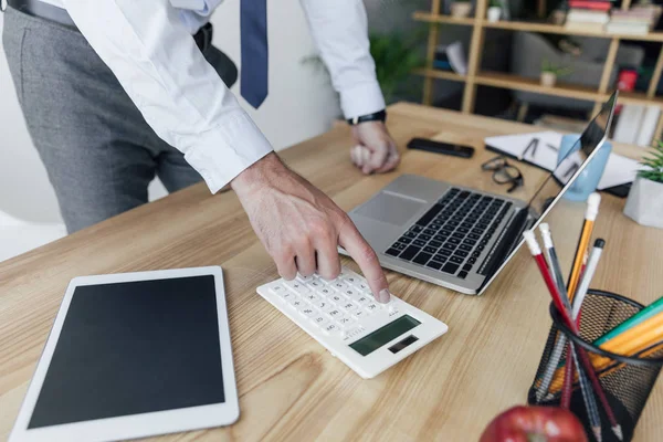 stock photo businessman using calculator